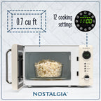Nostalgia Retro Compact Countertop Microwave Oven 0.7 Cu. Ft. 700-Watts Orange