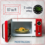 Nostalgia Retro Compact Countertop Microwave Oven 0.7 Cu. Ft. 700-Watts Orange